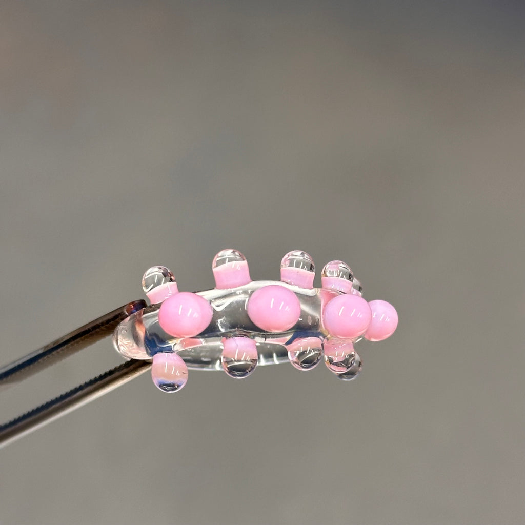 Anillo bolitas rosas y transparente