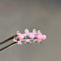 Anillo bolitas rosas y transparente