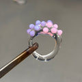 Anillo bolitas rosa y morado